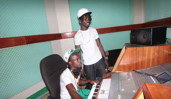 Bobi Wine and Mohammed Ali in his Fire Records Studio in Kamwokya.   Photo By Ismail Kezaala