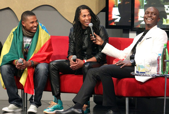 Ethiopia’s Bimp with South Africa’s Angelo and show host IK during their eviction. COURTESY PHOTO 