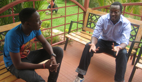 Moses Bwire has a chat with Shadrack Kutesa.   PHOTO BY ISAAC  SSEJJOMBWE