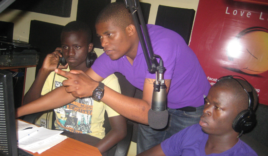 Andrew Kabuura shows his fans how he works in the Radiocity FM studios.  PHOTO BY ISAAC  SSEJJOMBWE