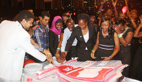 Students and university officials cut the third anniversary cake. PHOTOS BY ISMAIL KEZAALA