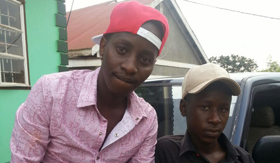 MC Kats (left) and his fan Richard Mwesigwa. PHOTO BY ISAAC SSEJJOMBWE