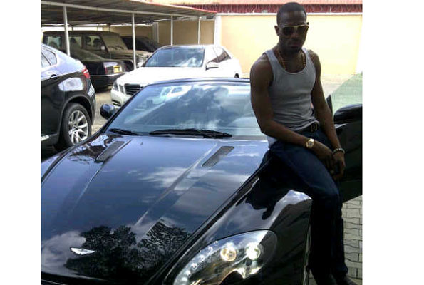 D’banj with his Aston Martin Vantage which reportedly cost over $200,000 (about Shs695m). 