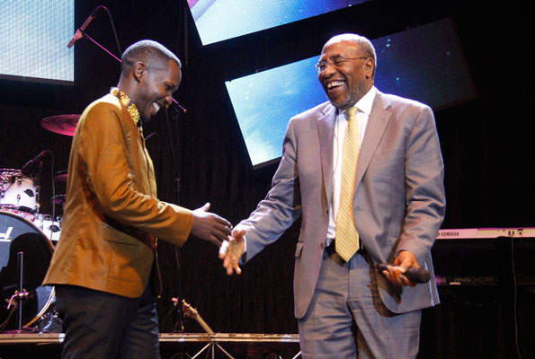 Comedian Pablo (L) cracked up Prime Minister Dr Ruhakana Rugunda at the Comedy Meets Music event. PHOTO By ABUBAKER LUBOWA