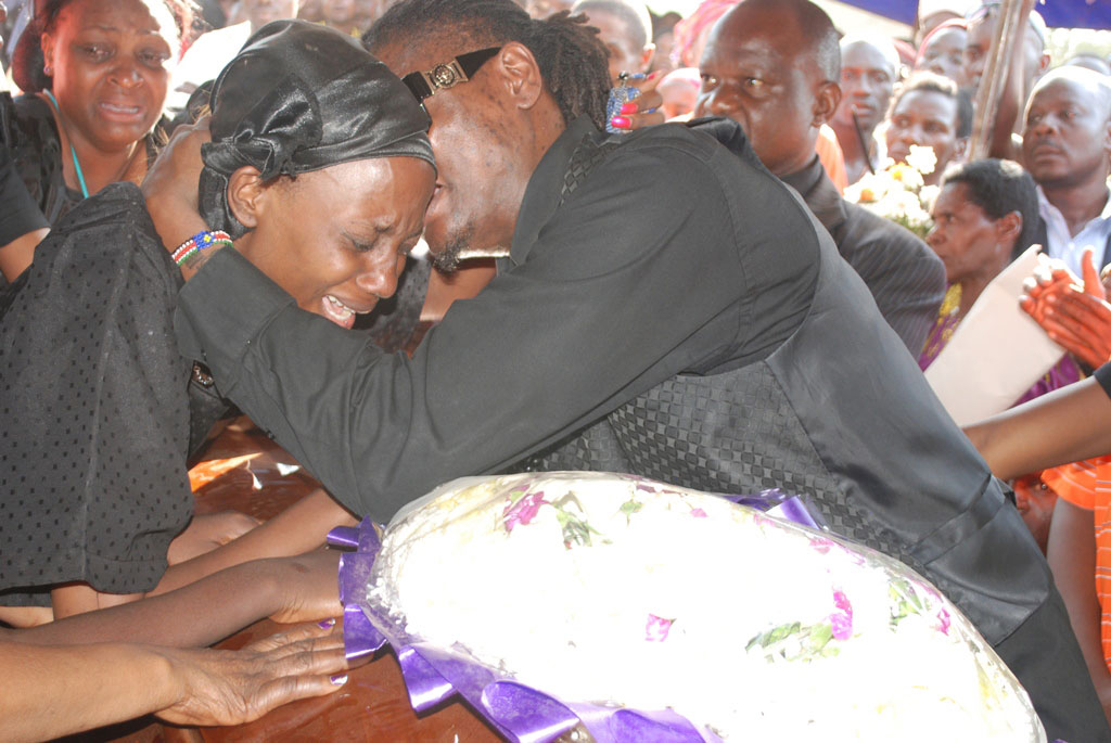AK47's widow is consoled by Pallaso. File Photo