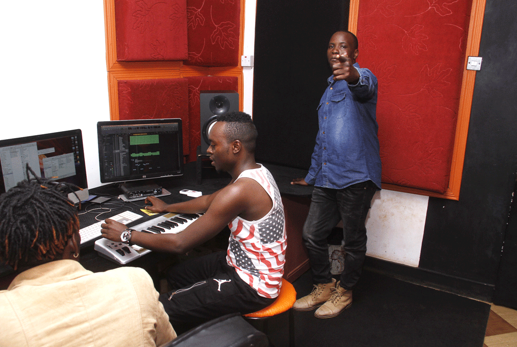  Jahlive with his man at work. He says he’s the bearer of a video’s vision. PHOTO by Abubaker Lubowa