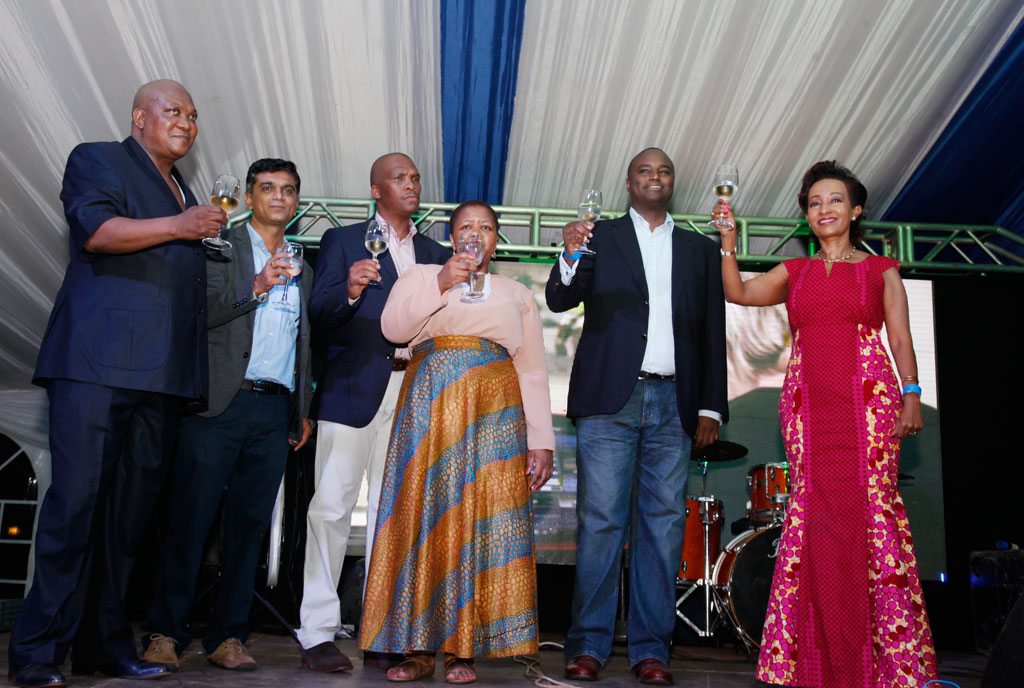 Prof. Lekoa Solly Mollo (L) and Yogi Birigwa (R) were joined by other guests to toast to the good relations between Uganda and South Africa. Photo by Rachel Mabala