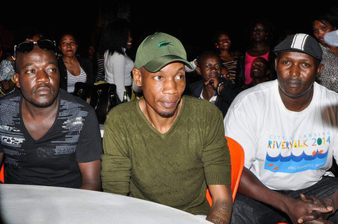 Young tycoon Bryan White (C) and his personal security at the Radio & Weasel 10 years anniversary concert 