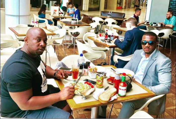 Roy Mubiru (Left) having dinner with Cameron Gitawo. Courtesy Photo