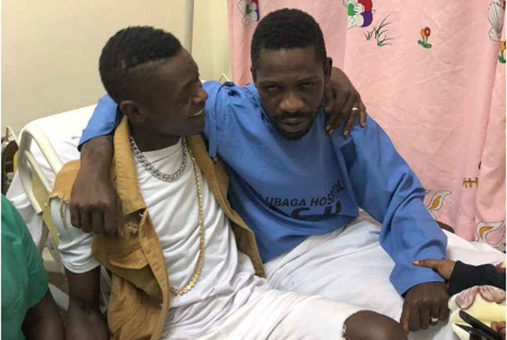 Jose Chameleone with Robert Kyagulanyi on his hospital bed at Lubaga Hospital