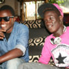 Rapper Gravity Omutujju (right) shares a light moment with his fan Shadrack. Photo By Abubaker Lubowa