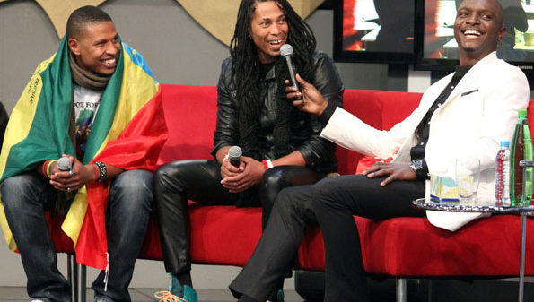 Ethiopia’s Bimp with South Africa’s Angelo and show host IK during their eviction. COURTESY PHOTO