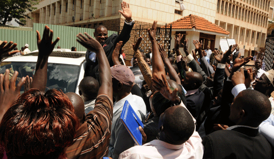 Man of the people: Sebaggala waves to supporters. Bottom is the former mayor dancing with his friend, musician Desire Luzinda at her previous concert. FILE PHOTOS