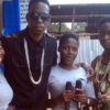 Bakri (2ndL) and AK 47 (R) pose with their fans. PHOTO BY ISAAC SSEJJOMBWE