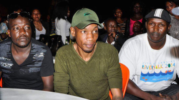 Young tycoon Bryan White (C) and his personal security at the Radio & Weazal 10 years anniversary concert