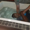 Remmy Bahati getting baptised at new christian life church, in Virginia, US.
